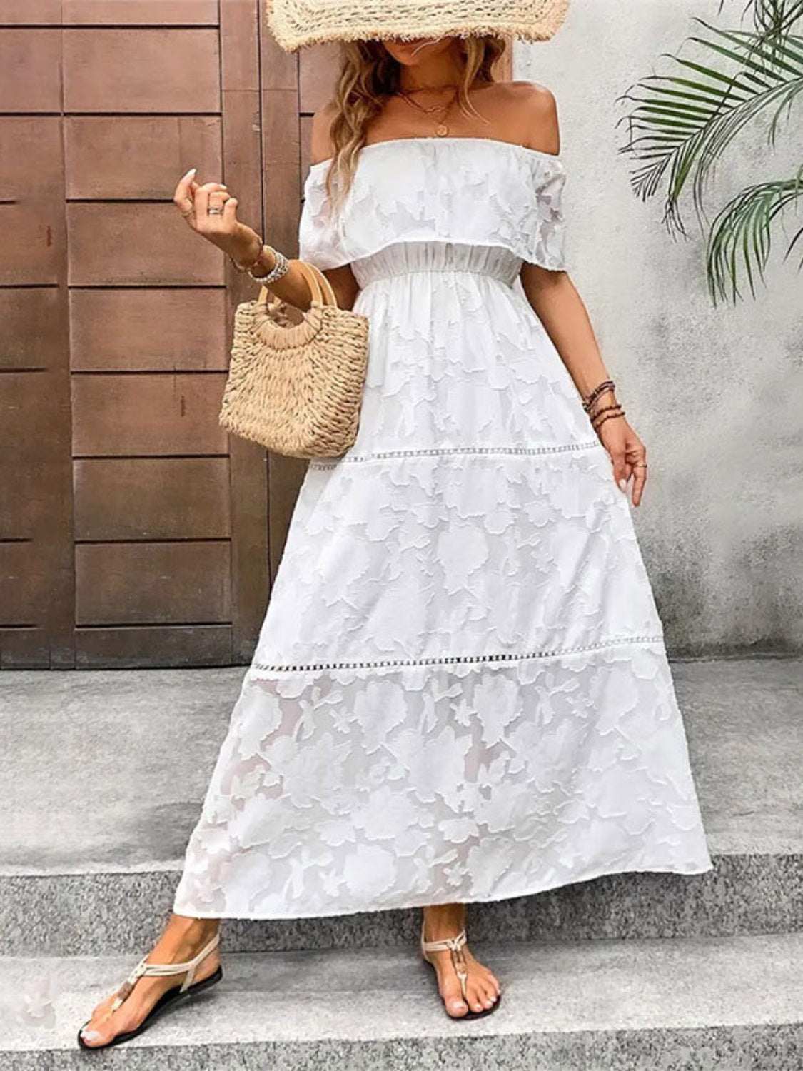 Off-shoulder short sleeve semi-sheer white maxi dress made of 100% polyester.