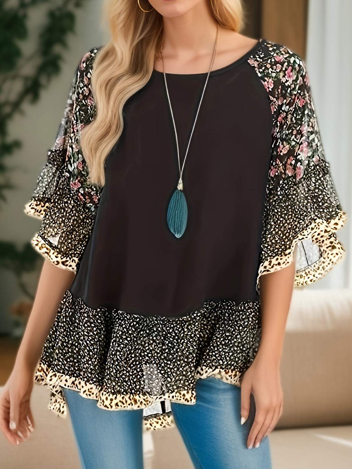 Full size frill printed round neck half sleeve blouse styled with floral pattern.