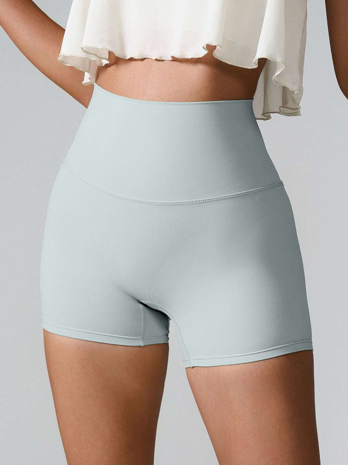 High Waist Active Shorts in light gray with a stretchy fit and pocket detail.