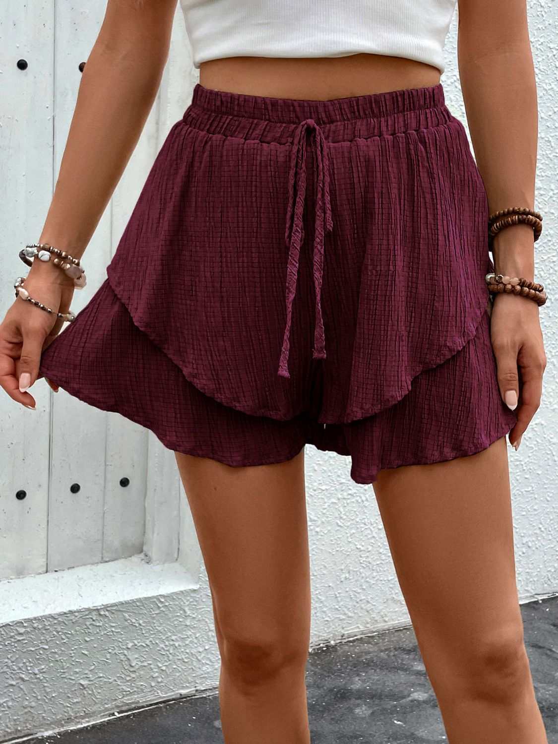 Perfee Tied Layered High Waist Shorts in burgundy with ruffled design.