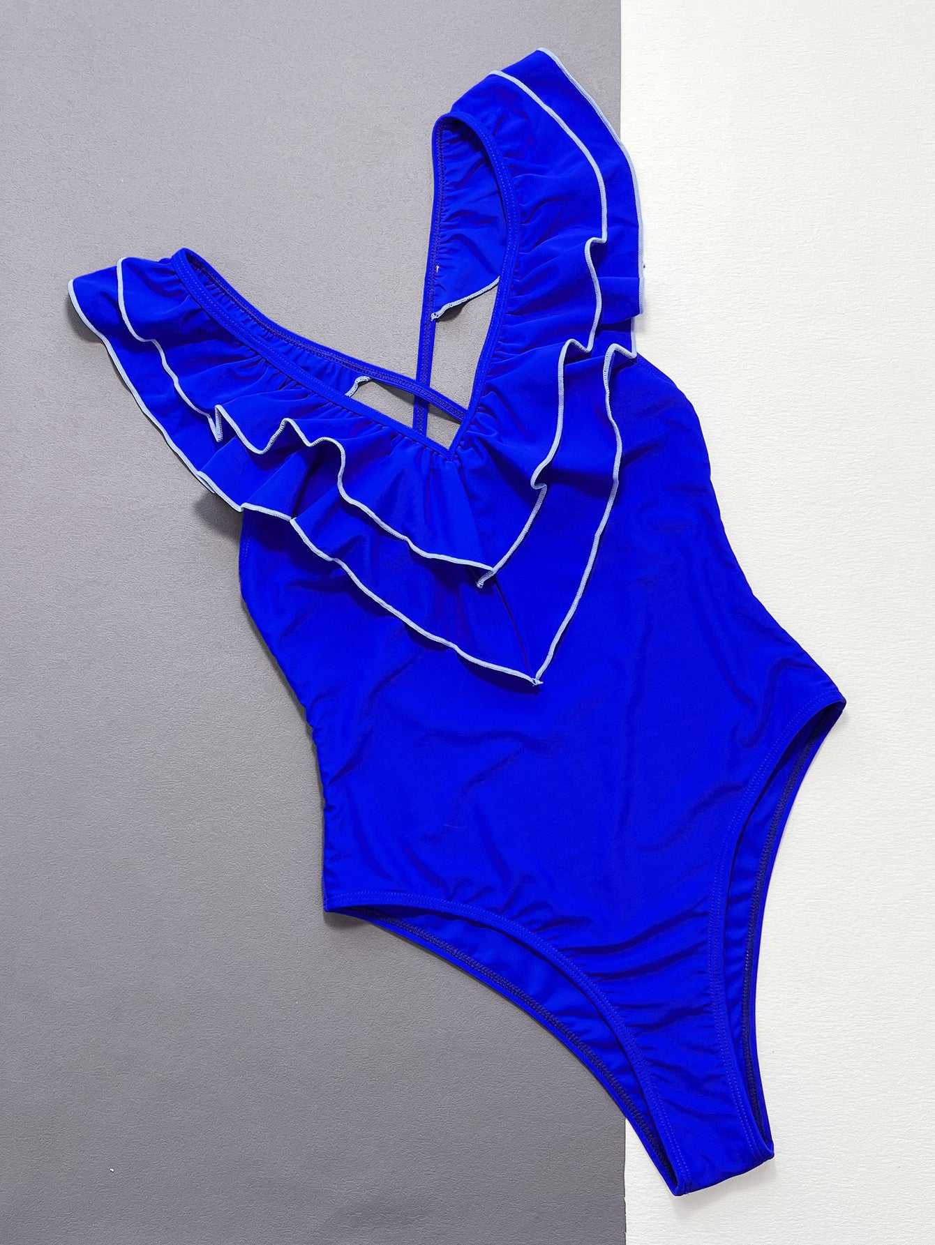 Ruffled crisscross backless one-piece swimsuit in solid blue with V-neck and removable padding.