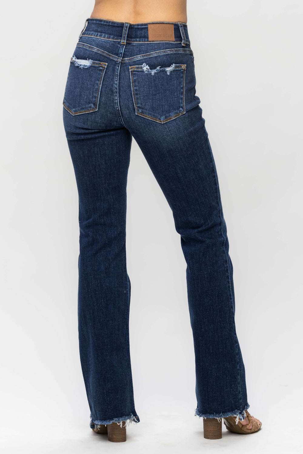 Judy Blue Full Size Frayed Hem Bootcut Jeans with distressed finish and raw hem detailing.