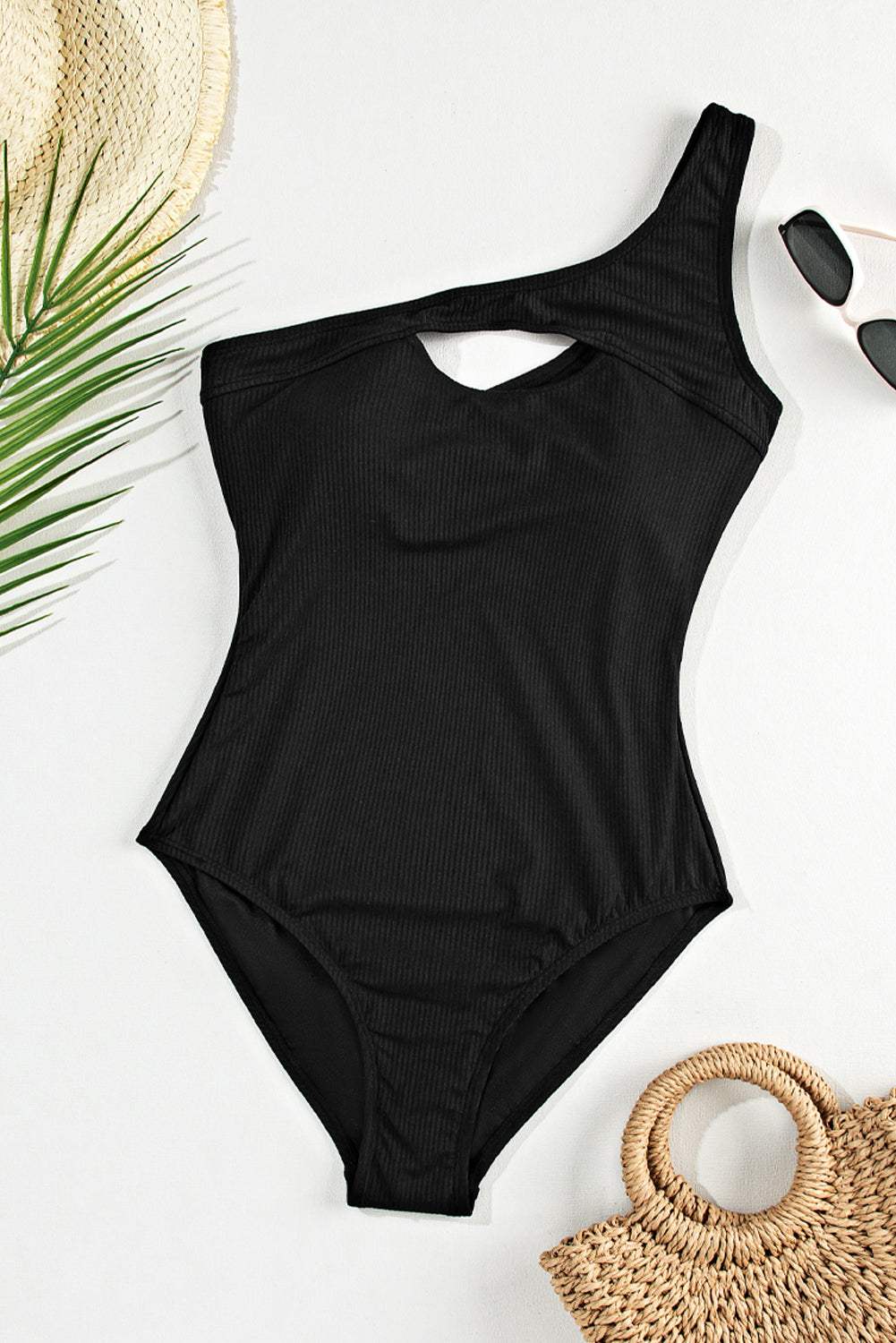 Cutout one shoulder sleeveless black one-piece swimwear with removable padding.