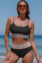 Two-piece swim set with scoop neck and spaghetti straps, stretchy nylon-spandex material, removable padding.