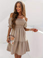 Full size ruffled off-shoulder short sleeve dress in beige with ruched detail.