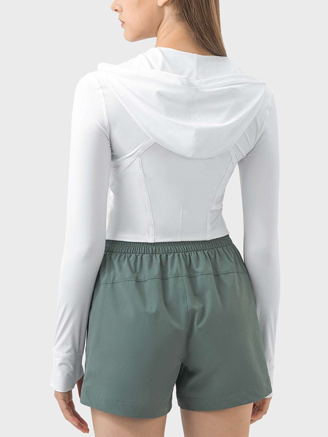 White hooded long sleeve active outerwear with zip-up design, made of stretchy nylon and spandex.