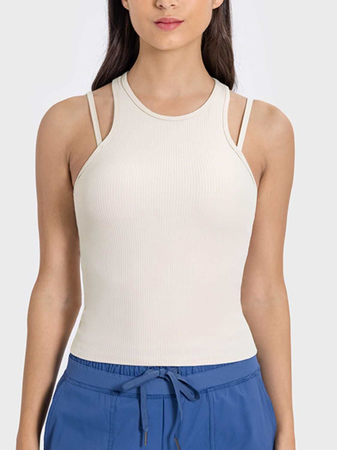 Millennia Cutout Round Neck Racerback Active Tank in white, featuring a basic style with moderate stretch.