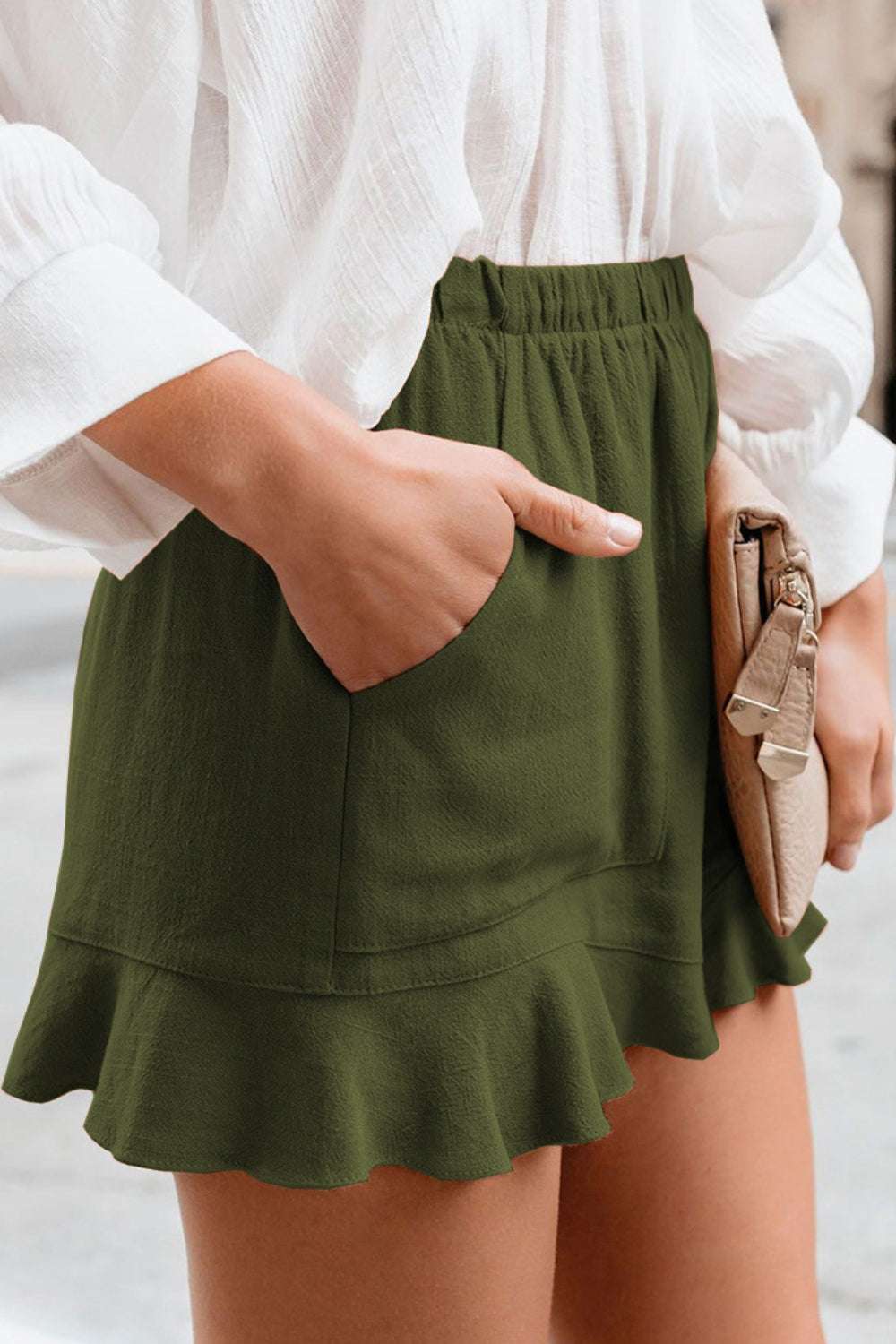 Green full size ruffled elastic waist shorts with side pockets.