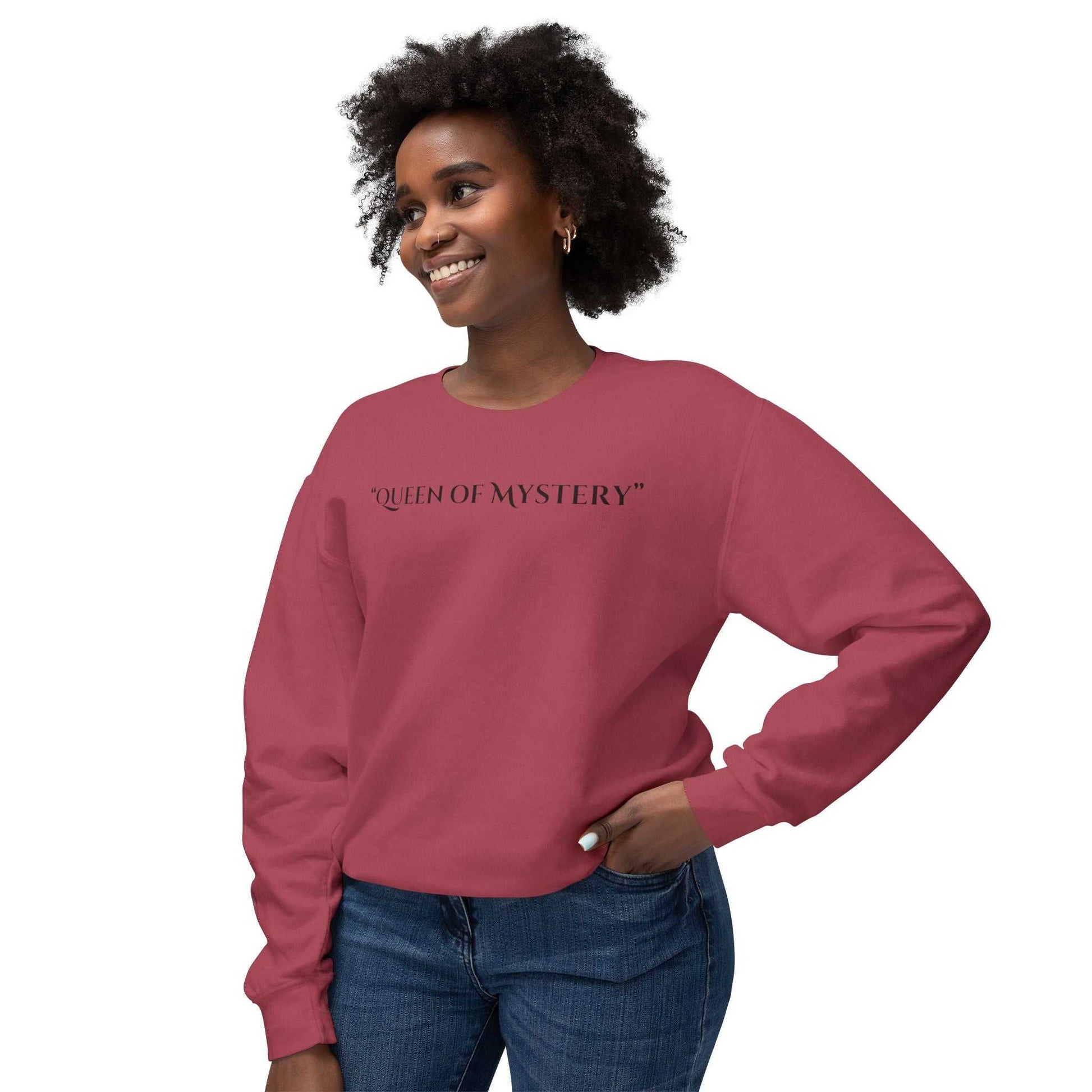 Woman wearing a Queens Mystery Sweatshirt with enigmatic design, ideal for casual and lounge wear.