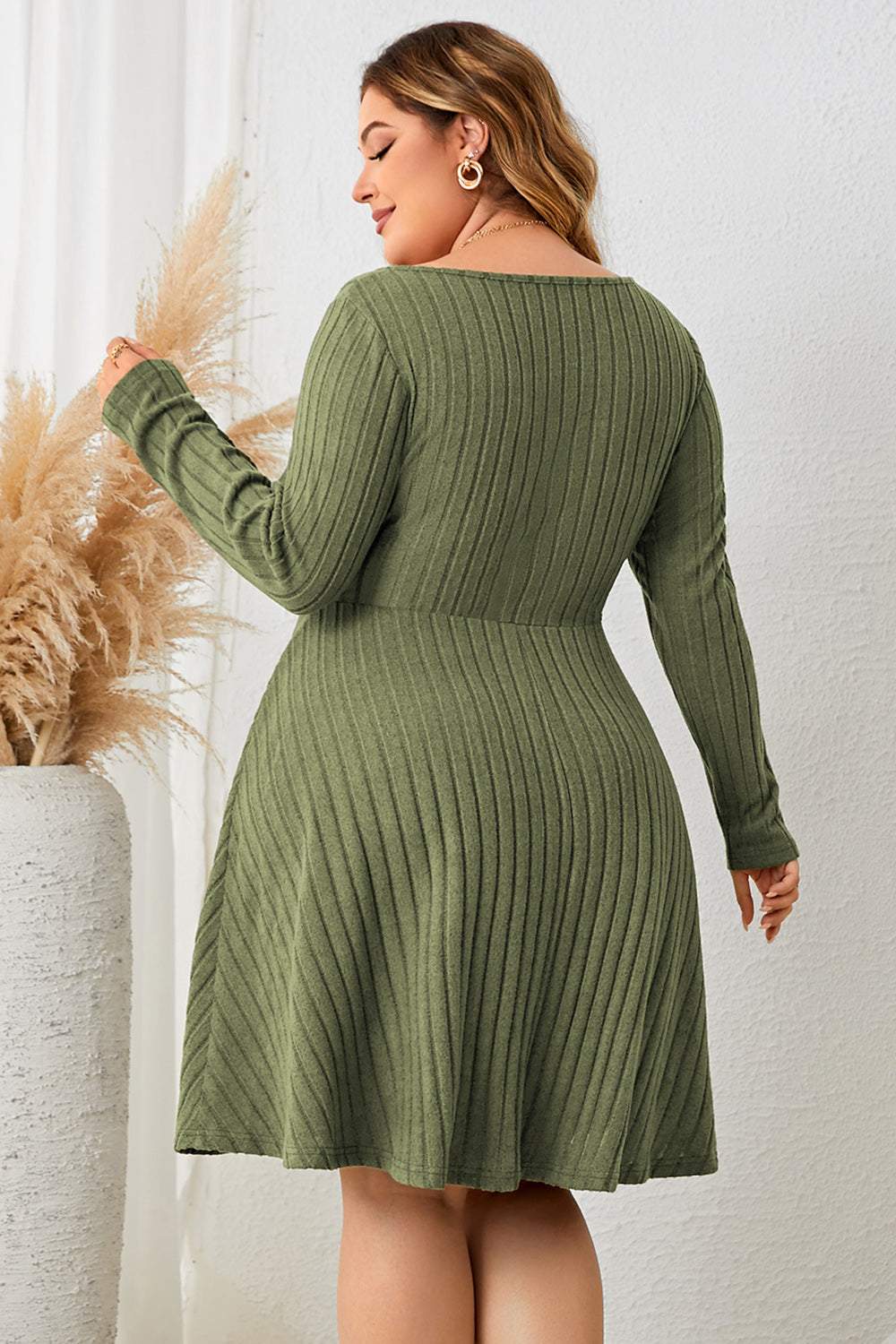 Plus size sweetheart neck long sleeve ribbed dress in green, back view.