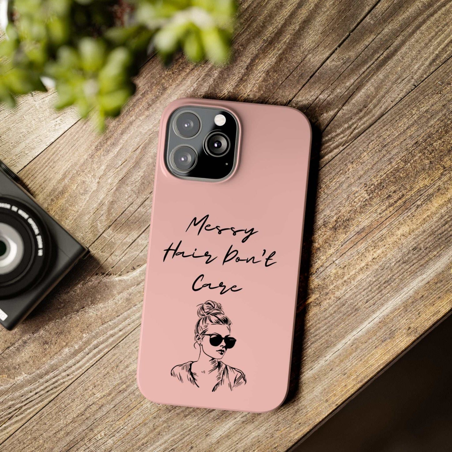 Baby pink phone case with "Messy Hair, Don't Care" print and girl illustration.