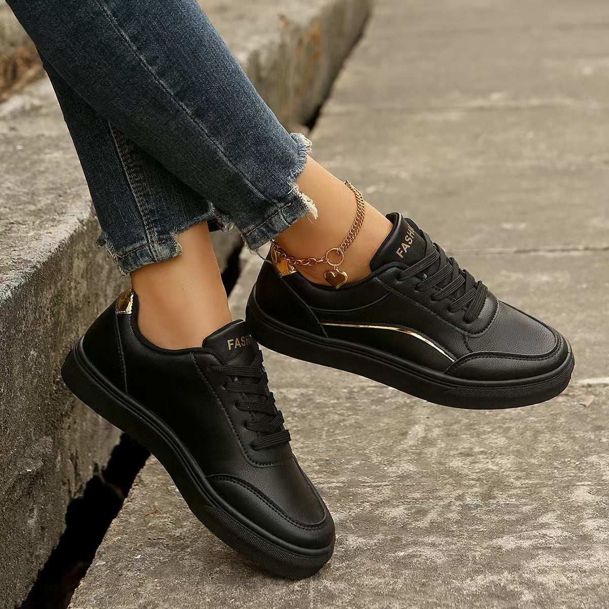 PU Leather Round Toe Flat Sneakers on a person, made of rubber and PU leather, stylish and casual.