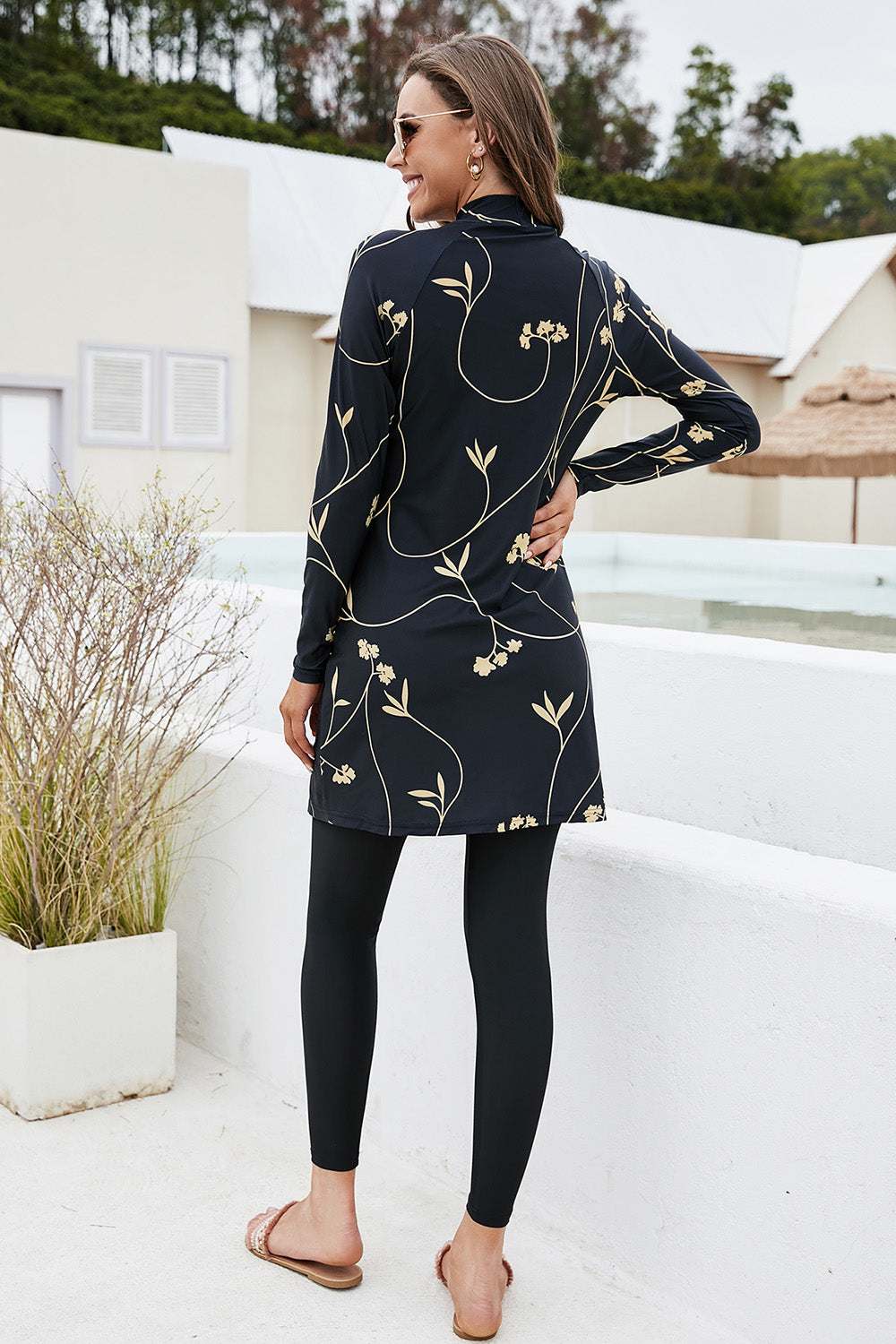 Printed mock neck long sleeve top and pants swim set with floral design.