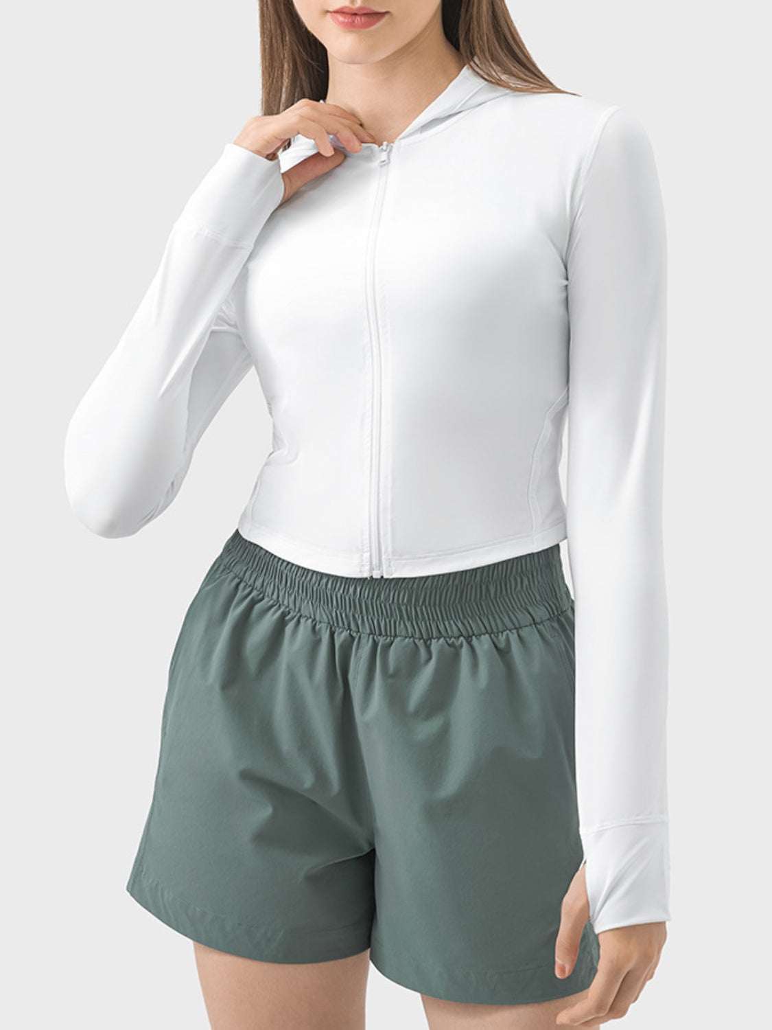 White hooded long sleeve active outerwear with zip, nylon-spandex blend.