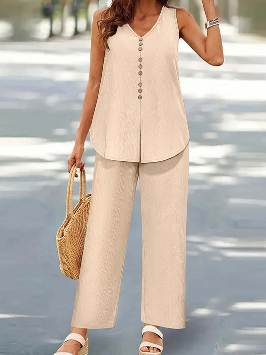 Plus size V-neck top and pants set with decorative buttons.