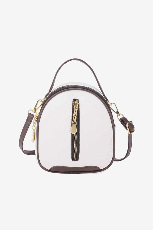 Small white PU leather handbag with brown accents and a front zipper.