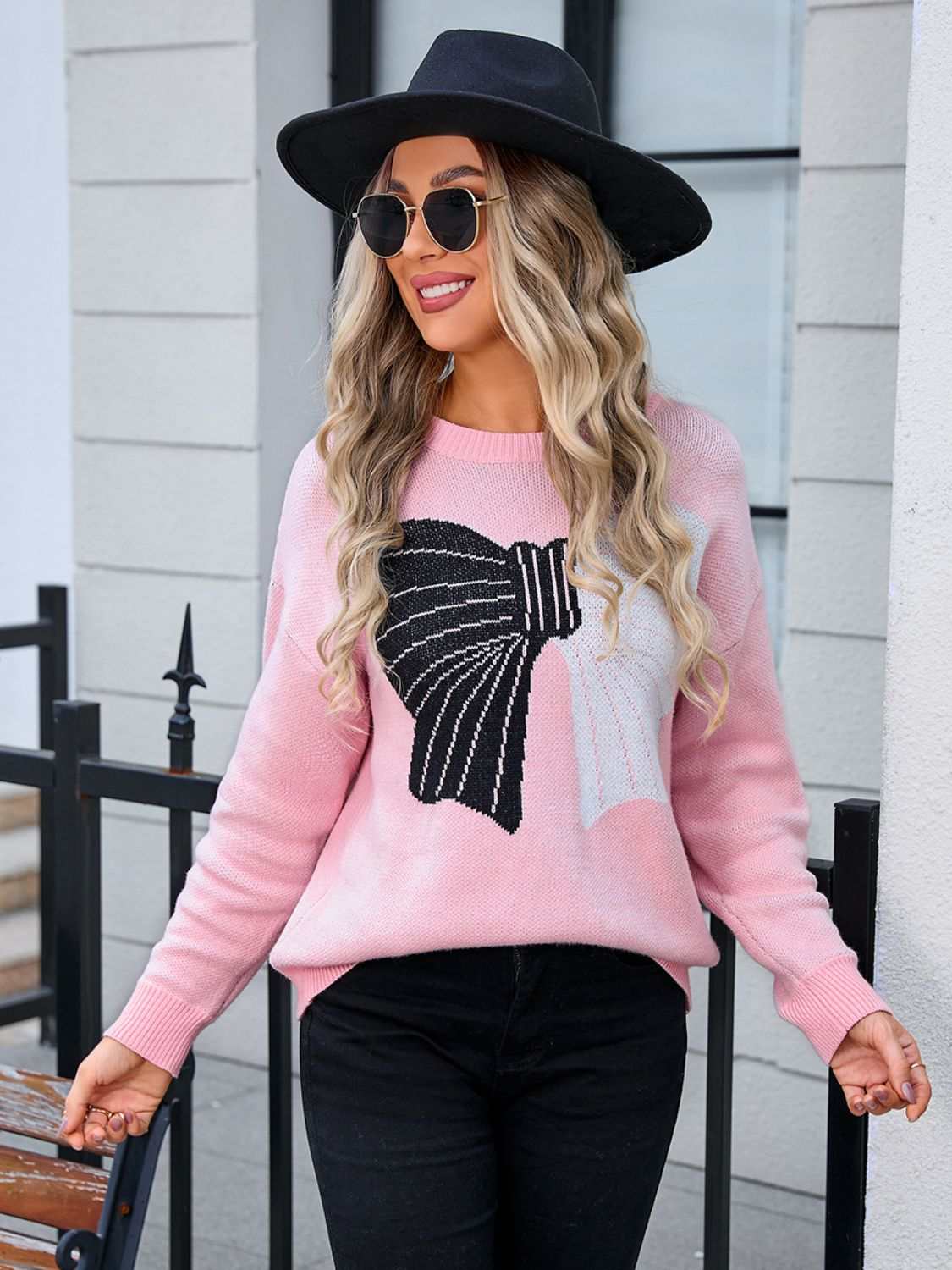 Pink angel wings bow round neck dropped shoulder sweater, moderate stretch, 100% acrylic.