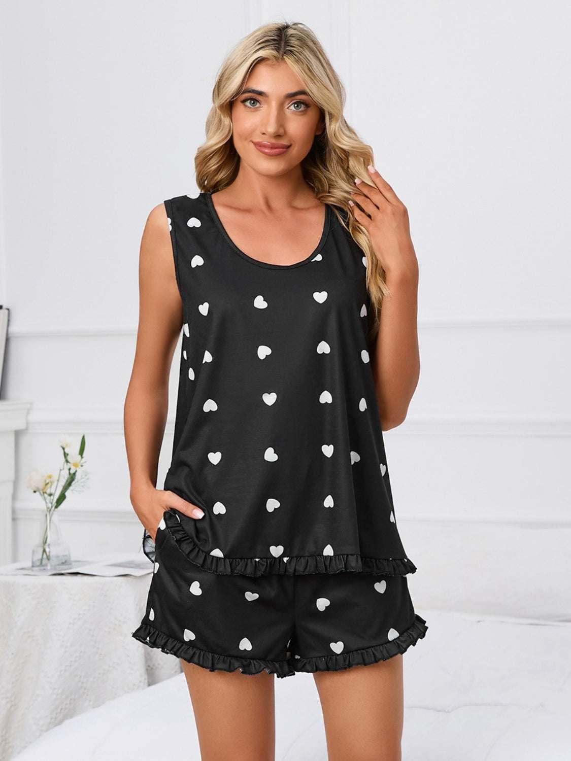 Heart scoop neck tank and shorts lounge set with heart pattern, two-piece, slightly stretchy, black and white.