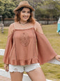 Plus size frill square neck long sleeve blouse with ruffled details.