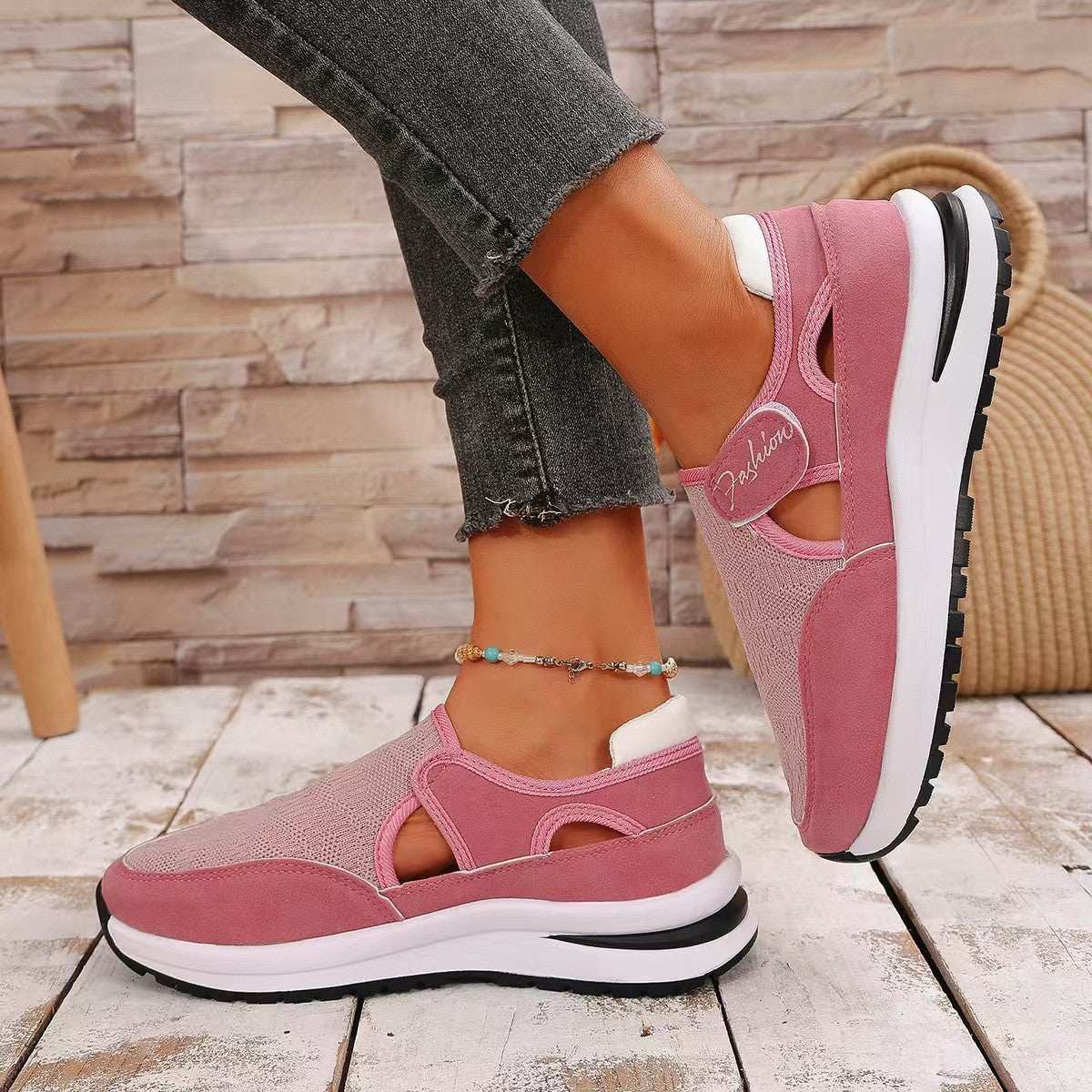 Mesh round toe platform sneakers in pink with mid heels and rubber sole.