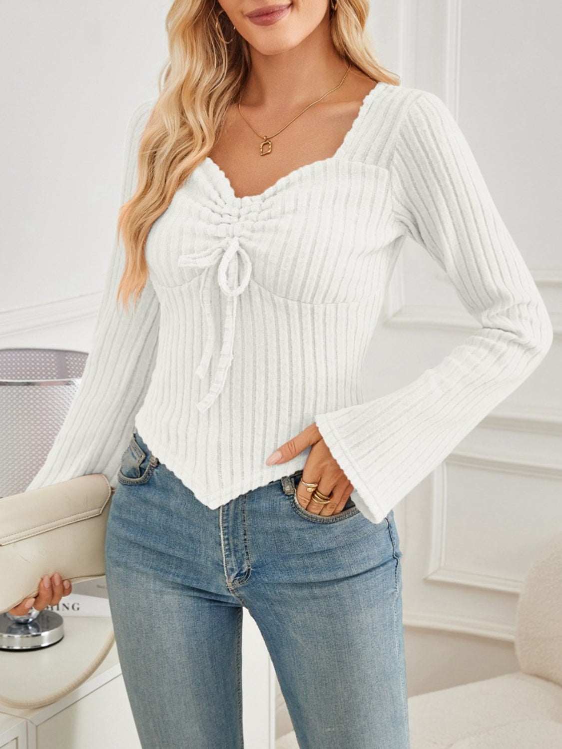 Ribbed drawstring long sleeve t-shirt in white, slightly stretchy with a flattering fit.