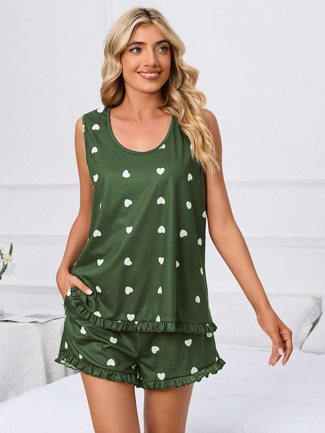 Heart scoop neck tank and shorts lounge set in green with white heart pattern, two-piece, slightly stretchy polyester and spandex fabric.