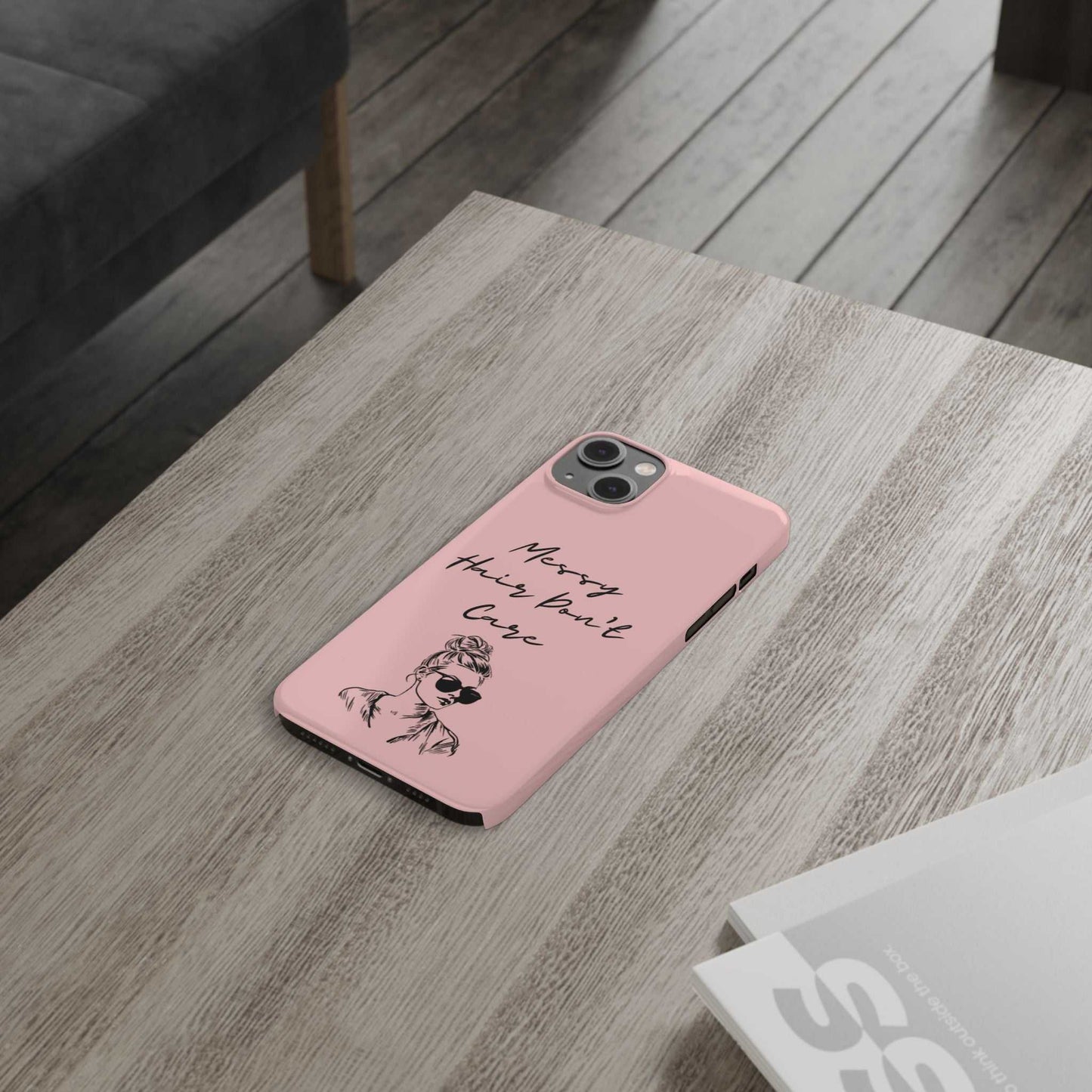 Baby pink phone case with "Messy Hair, Don't Care" quote, trendy design for young women.