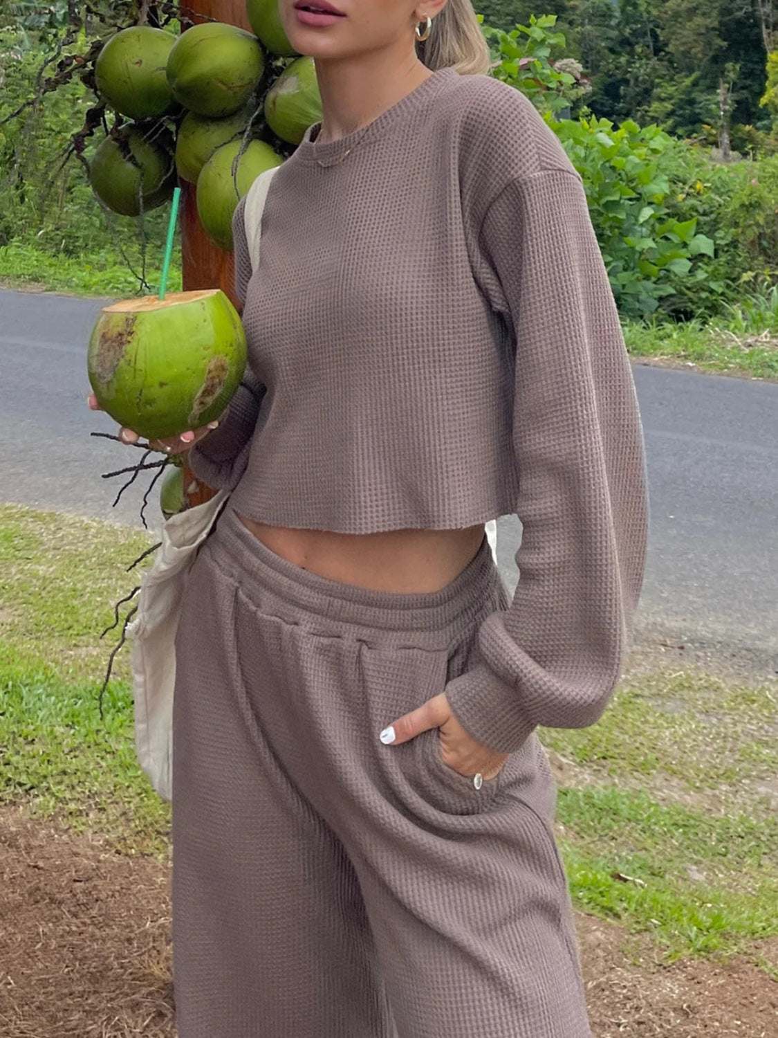 Waffle-knit round neck top and pants set in taupe, outdoor setting.