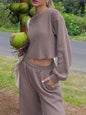 Waffle-knit round neck top and pants set in taupe, outdoor setting.