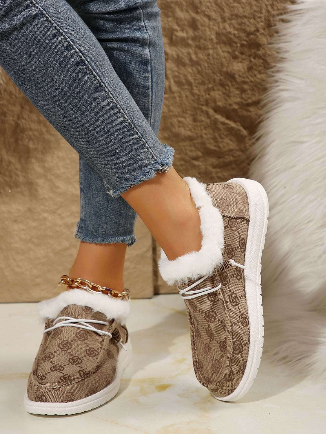 Printed round toe flat slip-ons with faux fur, cotton, and EVA material.