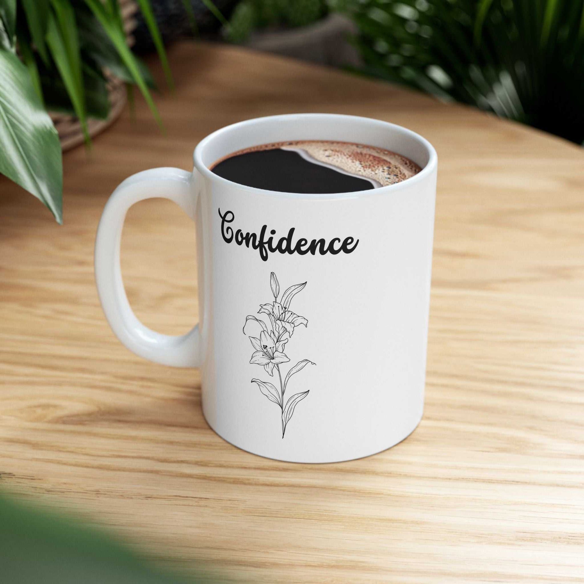 Ceramic mug with confidence lily design, glossy, vibrant colors, dishwasher and microwave safe.