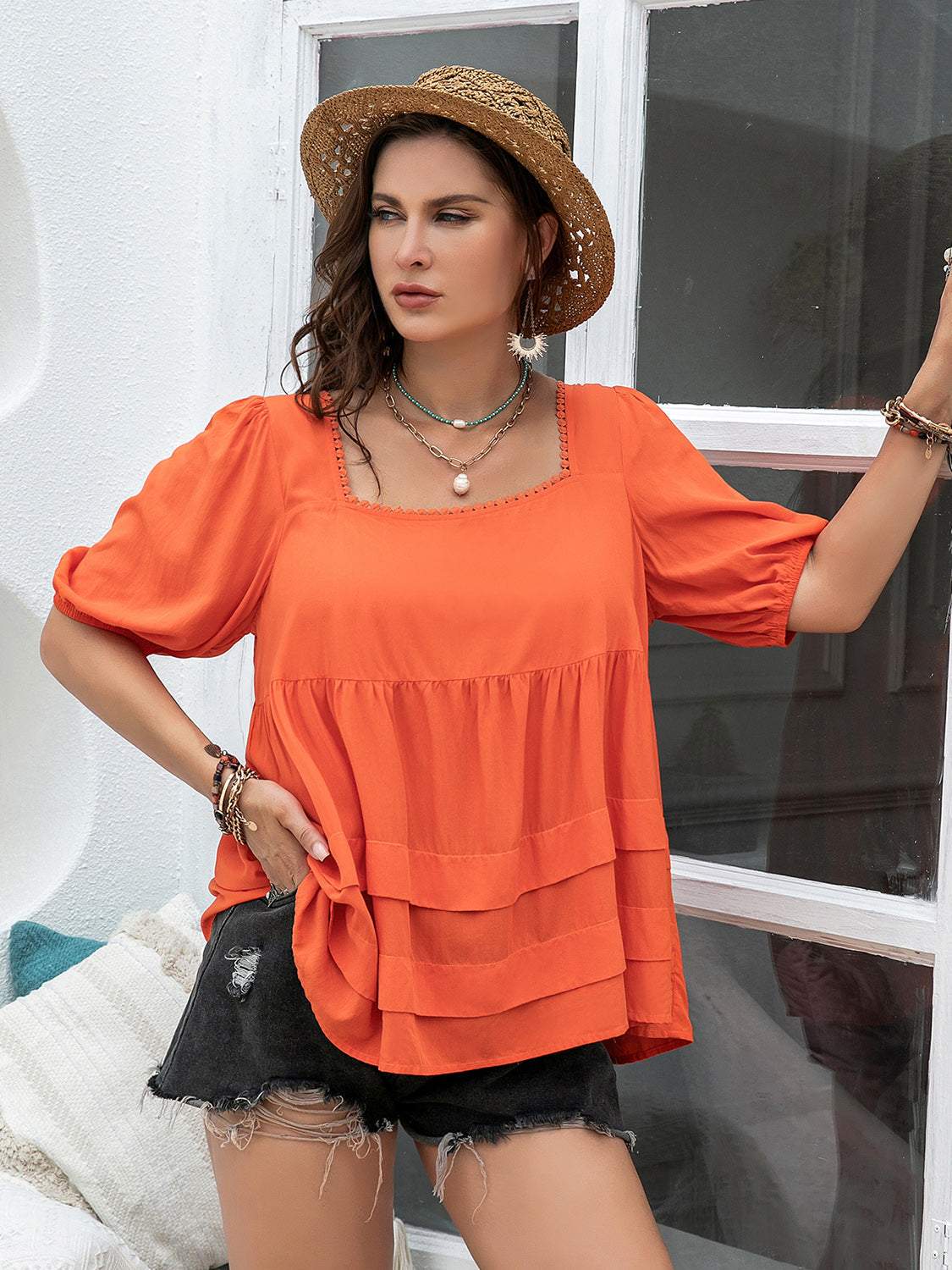 Plus size square neck half sleeve blouse in orange with ruched design and no stretch.