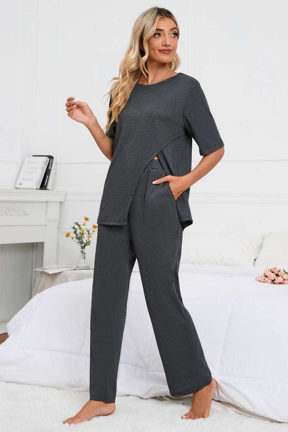 Slit round neck top and pants lounge set in dark grey with short sleeves.