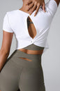 Cutout round neck short sleeve active T-shirt in white, back view showing stylish cutout design.