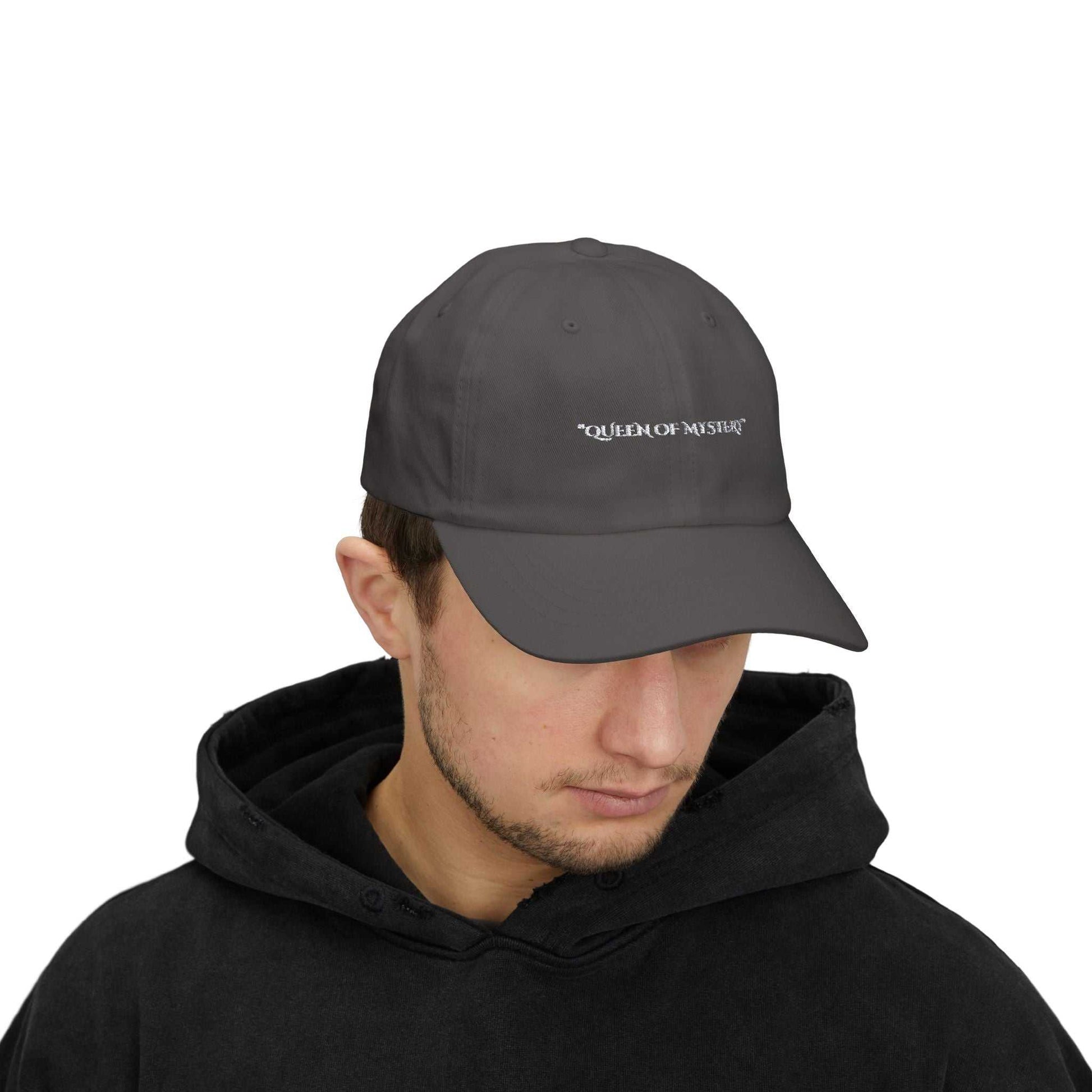 Classic Dad Cap with "Queen of Mystery" text, feminine and empowering design, 6-panel precurved visor, adjustable snap closure.