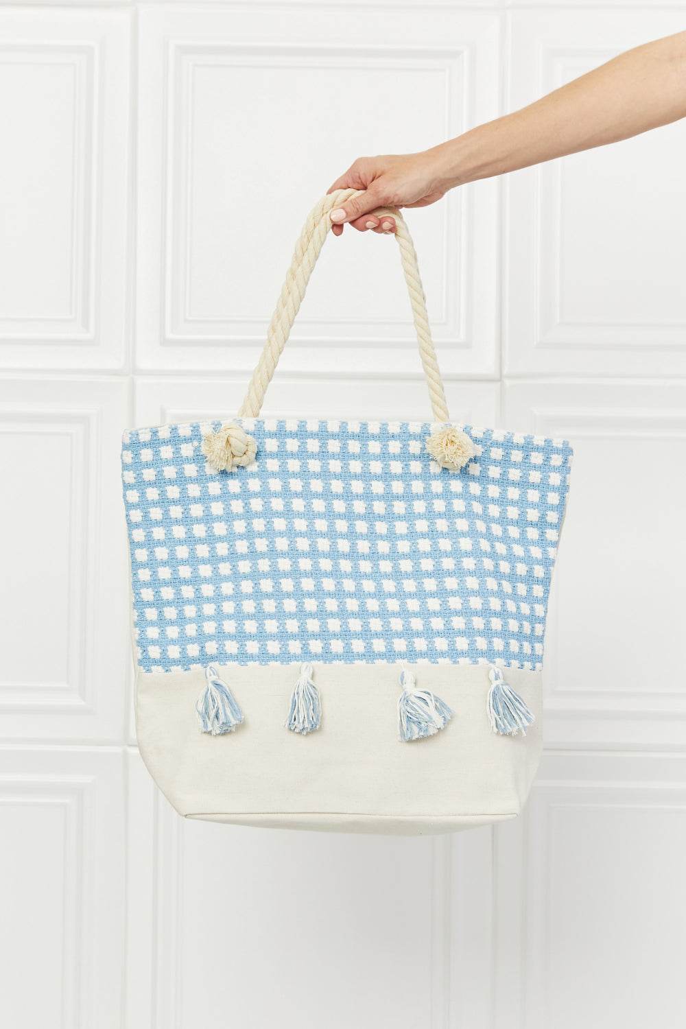 Justin Taylor Picnic Date Tassel Tote Bag with plaid pattern and rope handles.