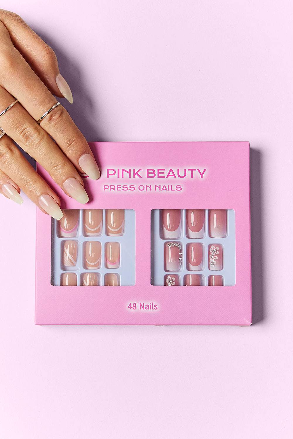 SO PINK BEAUTY Press On Nails 2 Packs showcasing two elegant nail designs in pink packaging.