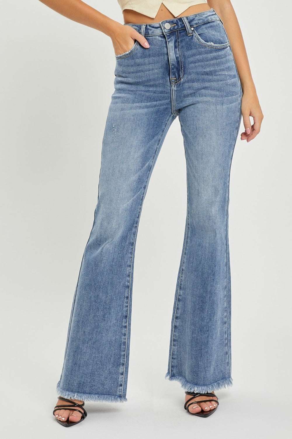 RISEN full size high waist raw hem flare jeans with edgy detailing and trendy fit.