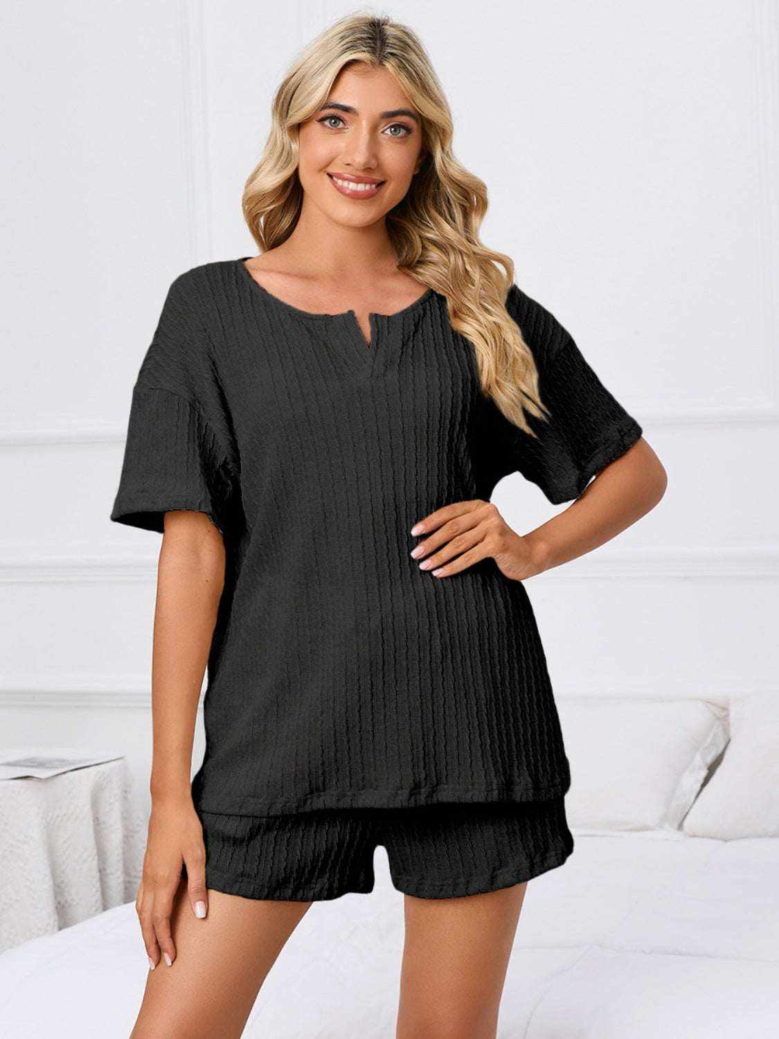 Notched short sleeve and shorts lounge set in black, two-piece outfit, slightly stretchy fabric.