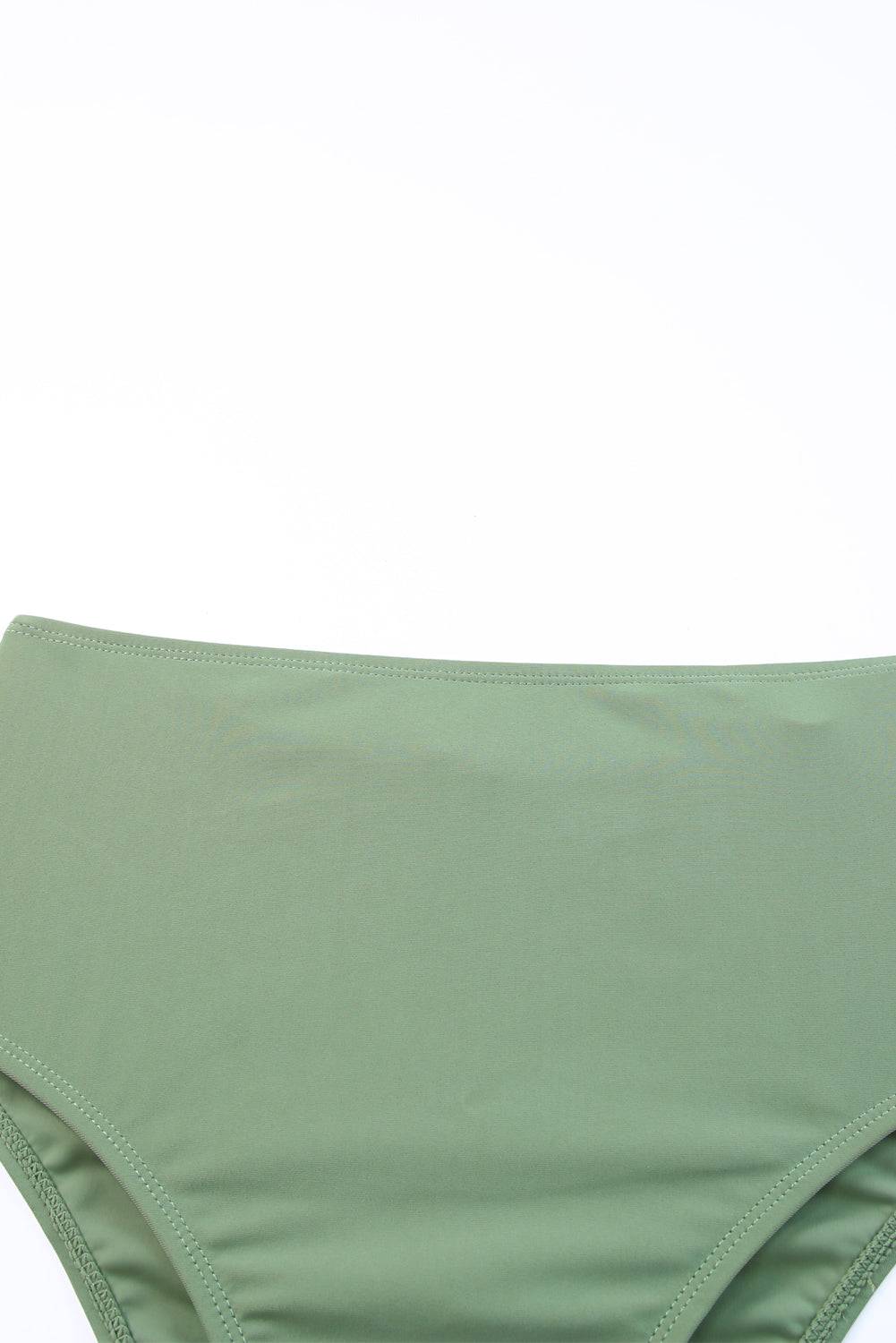 Green mid waist bottoms from tie back sleeveless swim dress set.