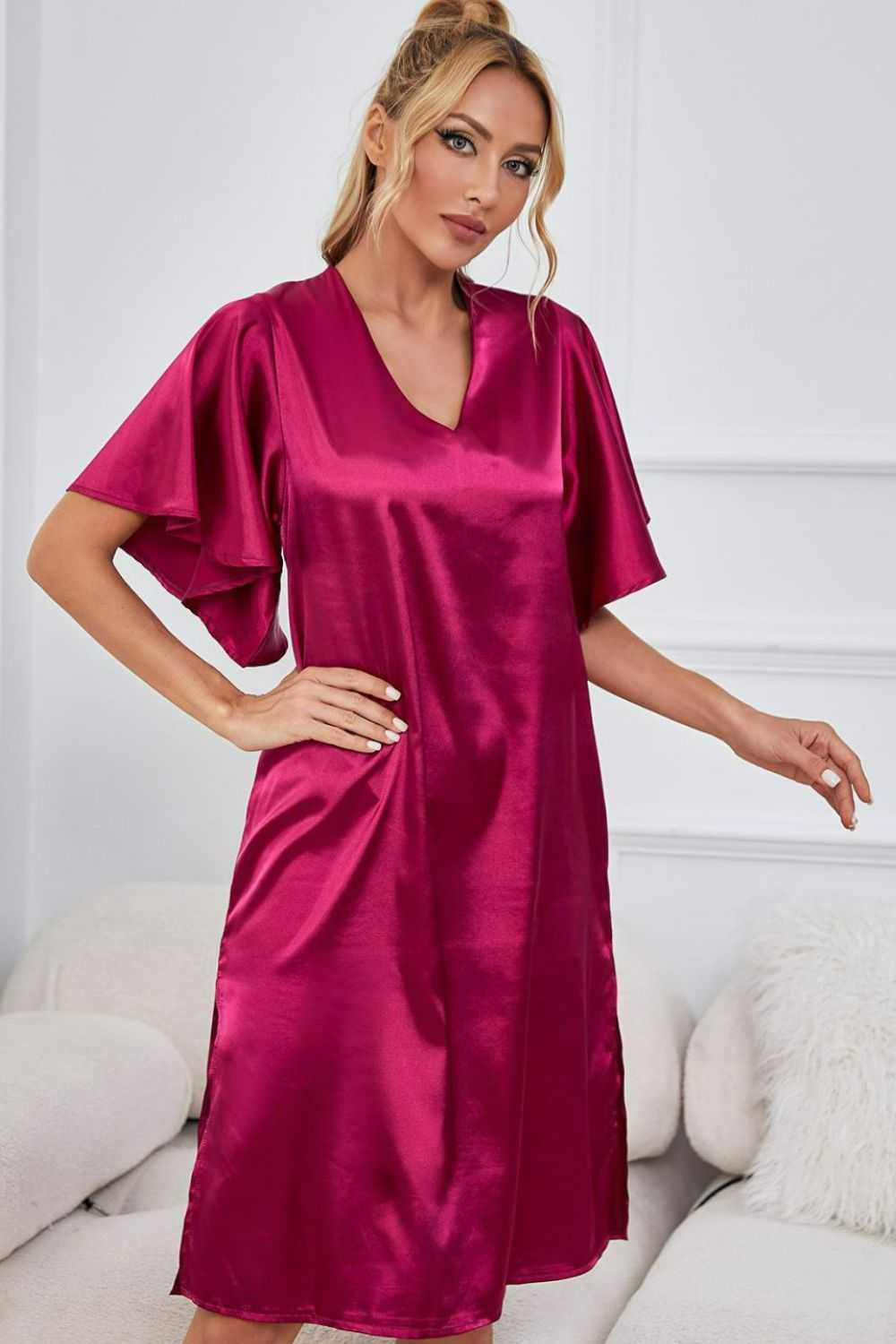 Satin night dress with flutter sleeves and side slit in solid color.