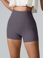 High waist active shorts, pocketed, highly stretchy nylon-spandex blend.