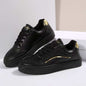 PU leather round toe flat sneakers with rubber soles and gold accents.