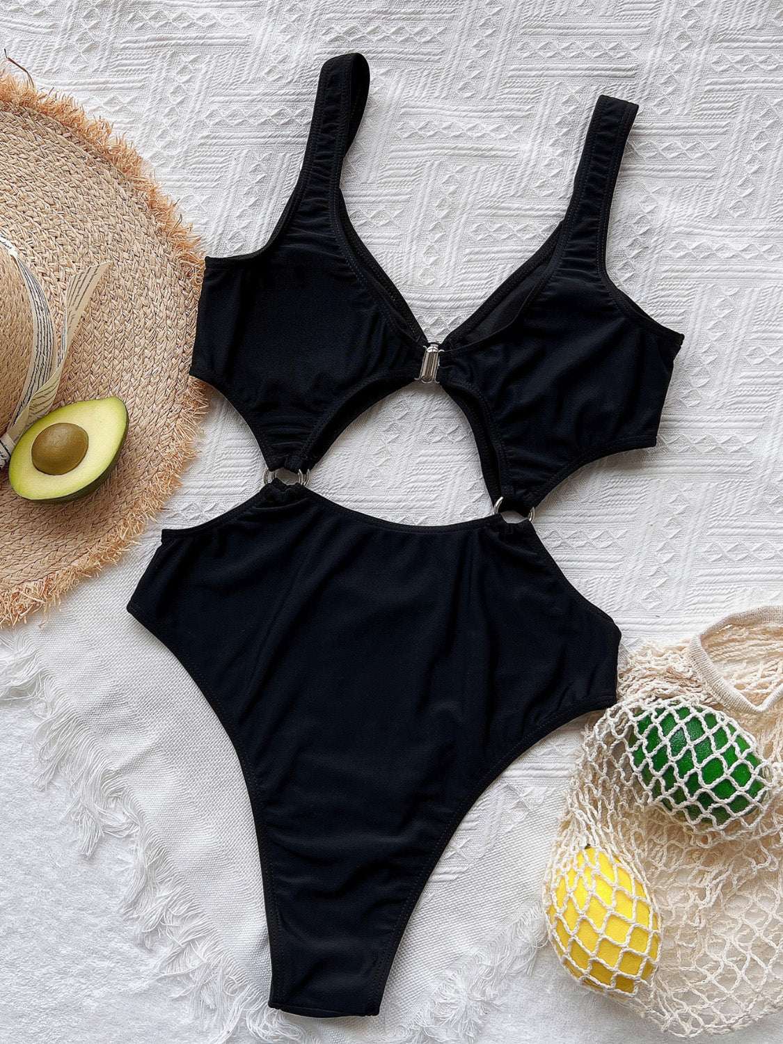 Cutout plunge one-piece swimwear with removable padding and stretchy material.