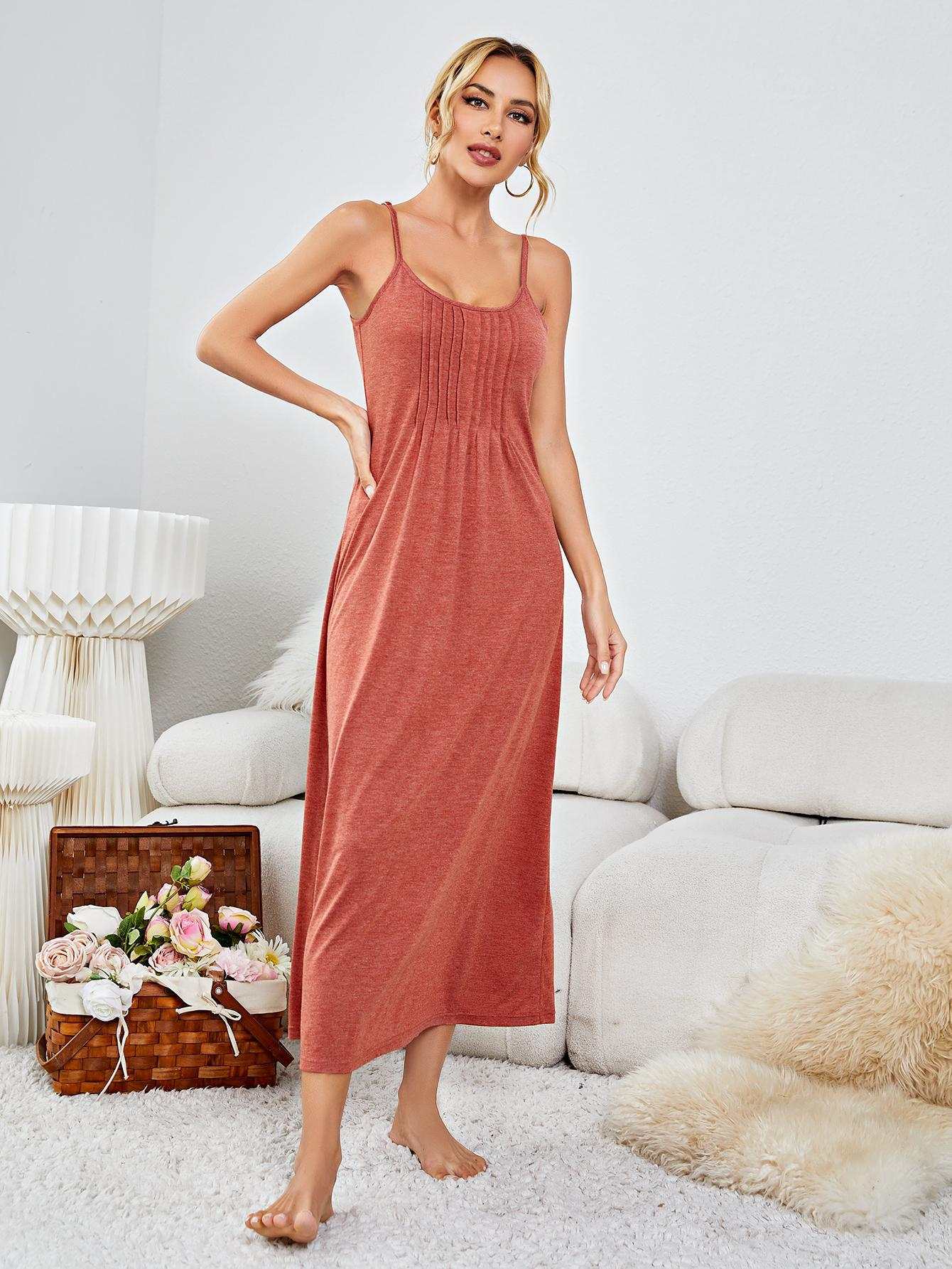 Scoop neck spaghetti strap night dress in solid color, minimalist sleeveless design.