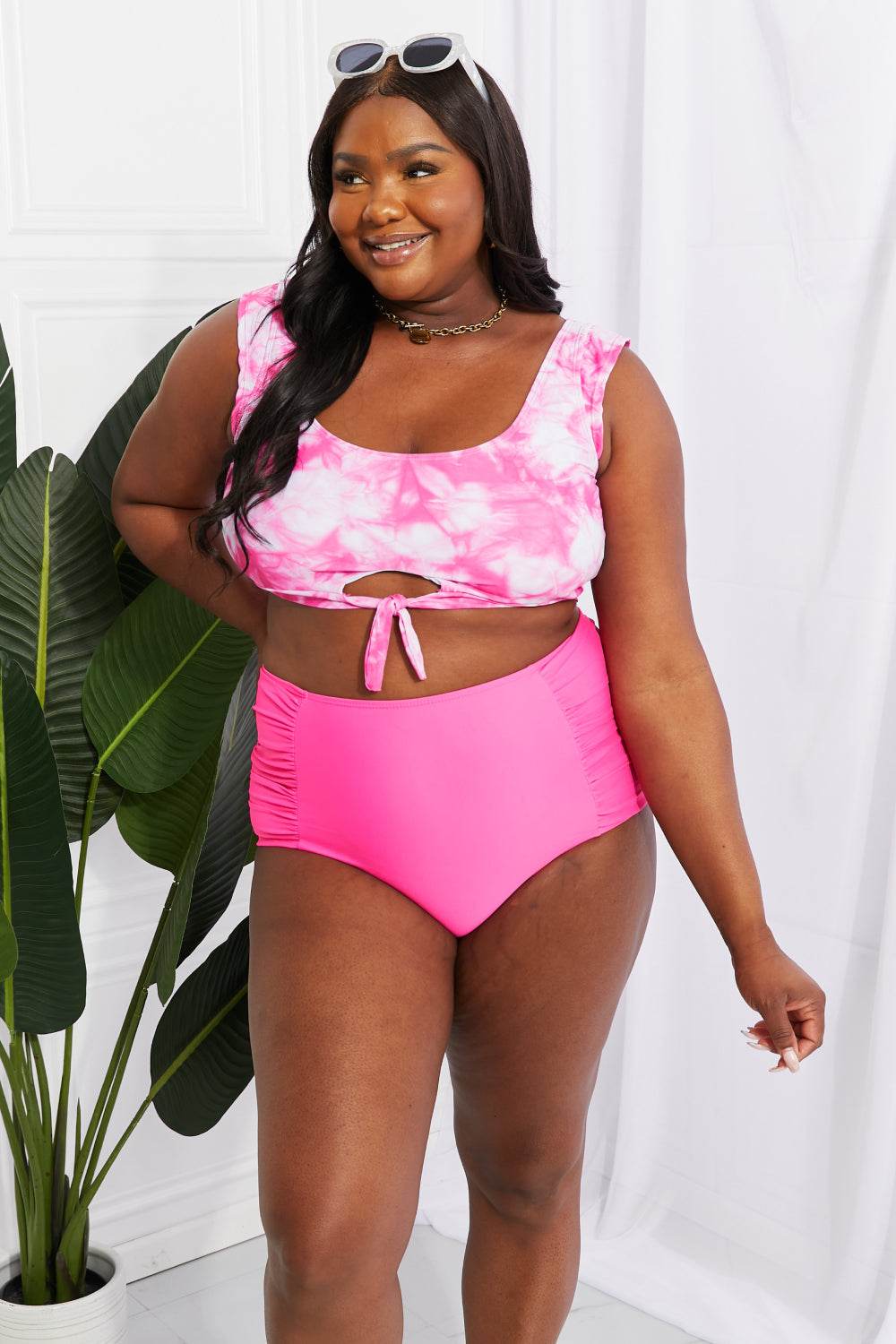 Marina West Swim Sanibel pink crop swim top and ruched high waist bottoms with tie-dye pattern.