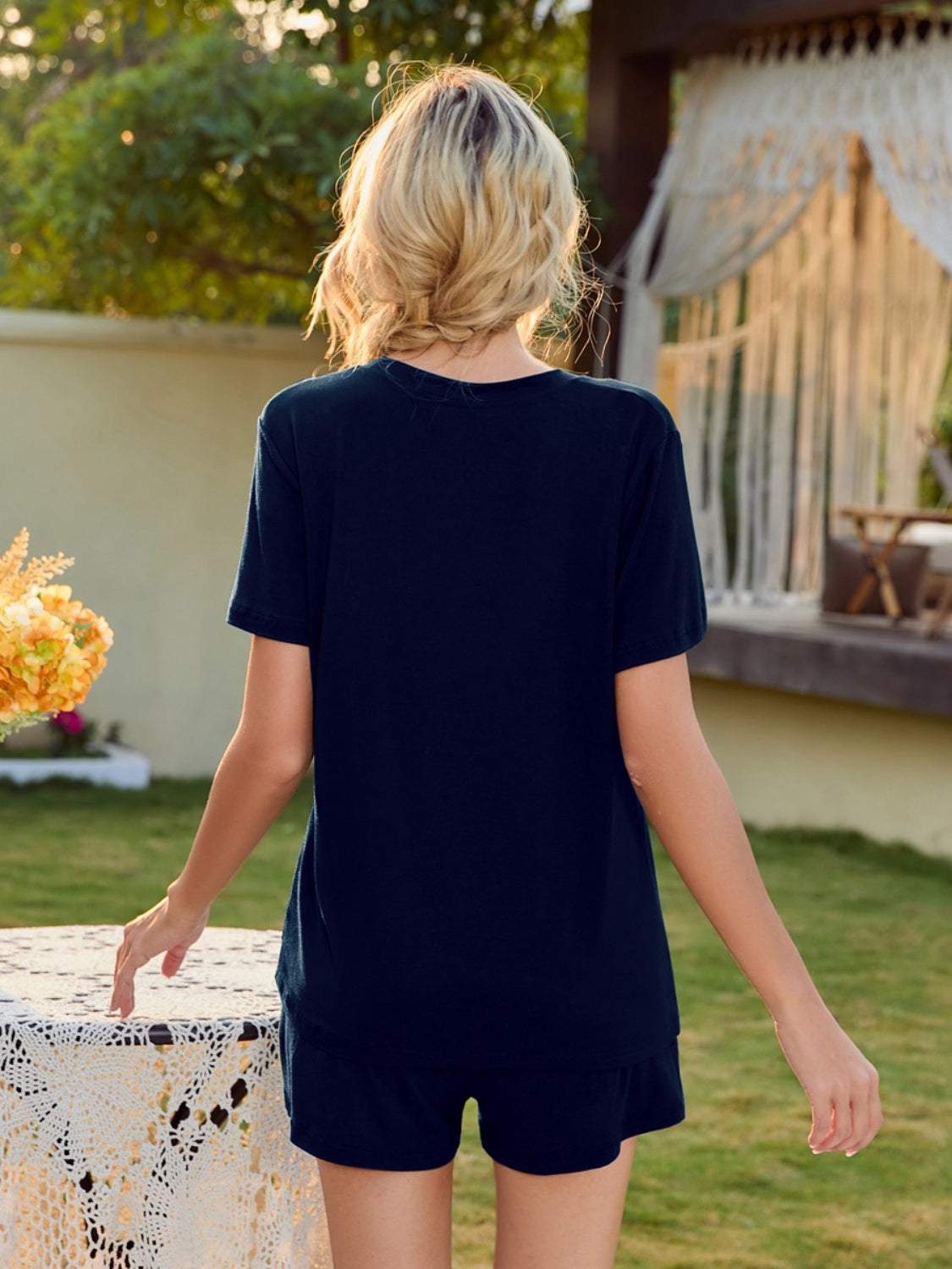 V-Neck Short Sleeve Top and Pocketed Shorts Lounge Set in black, back view.