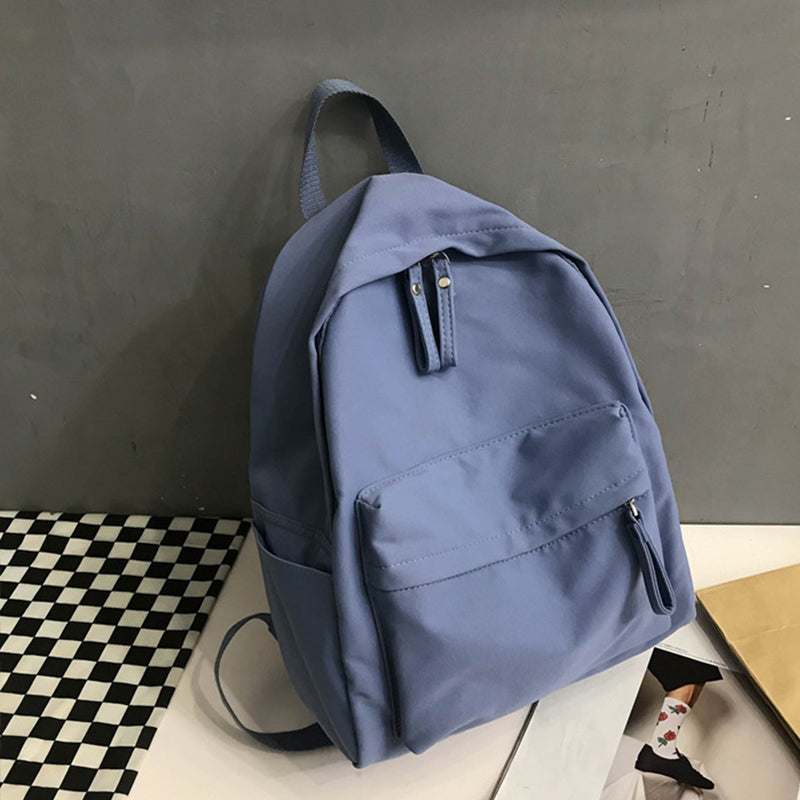 Blue zip cotton backpack bag, large size, imported, with front pocket and handle.