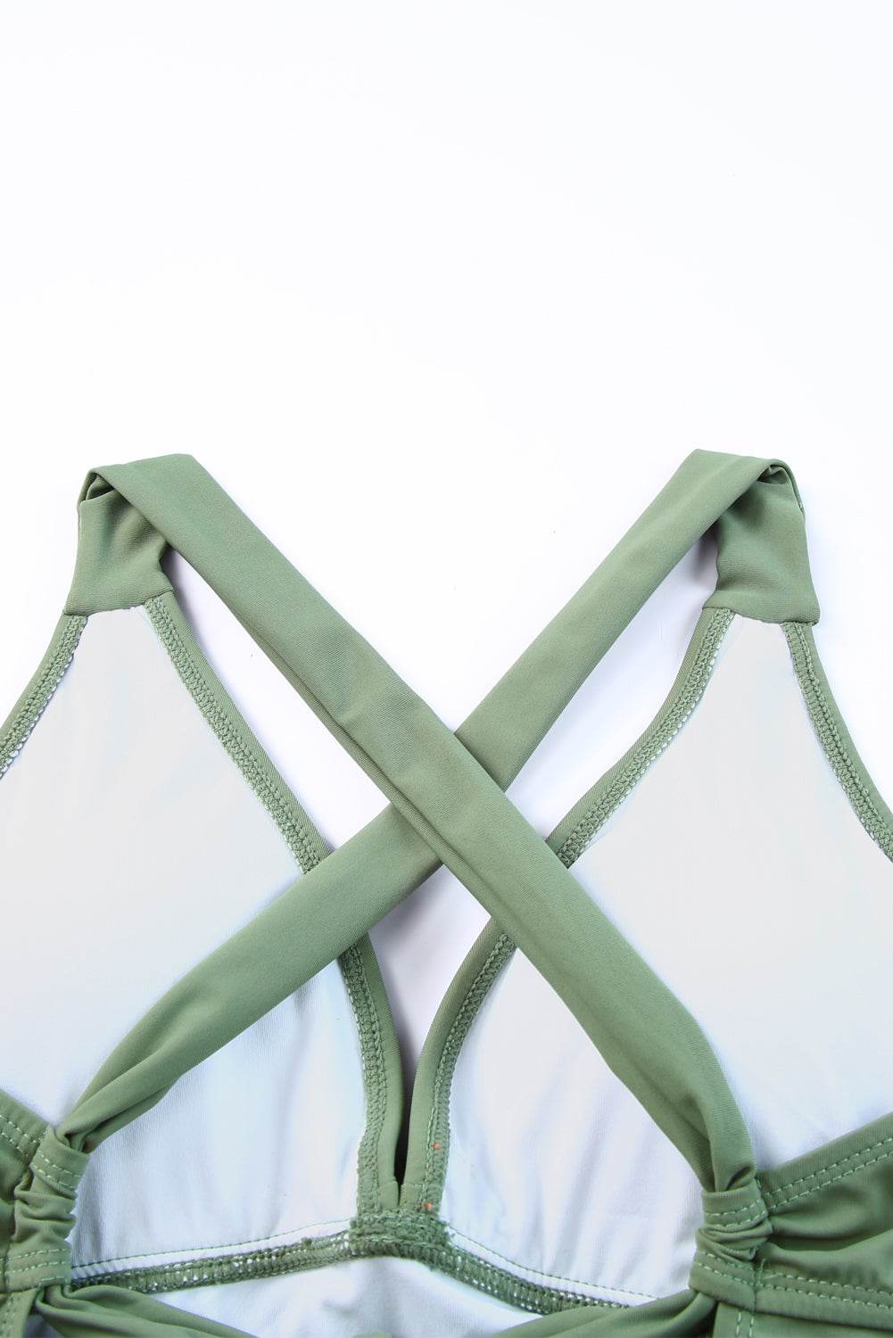 Crisscross design on green tie back sleeveless swim dress.