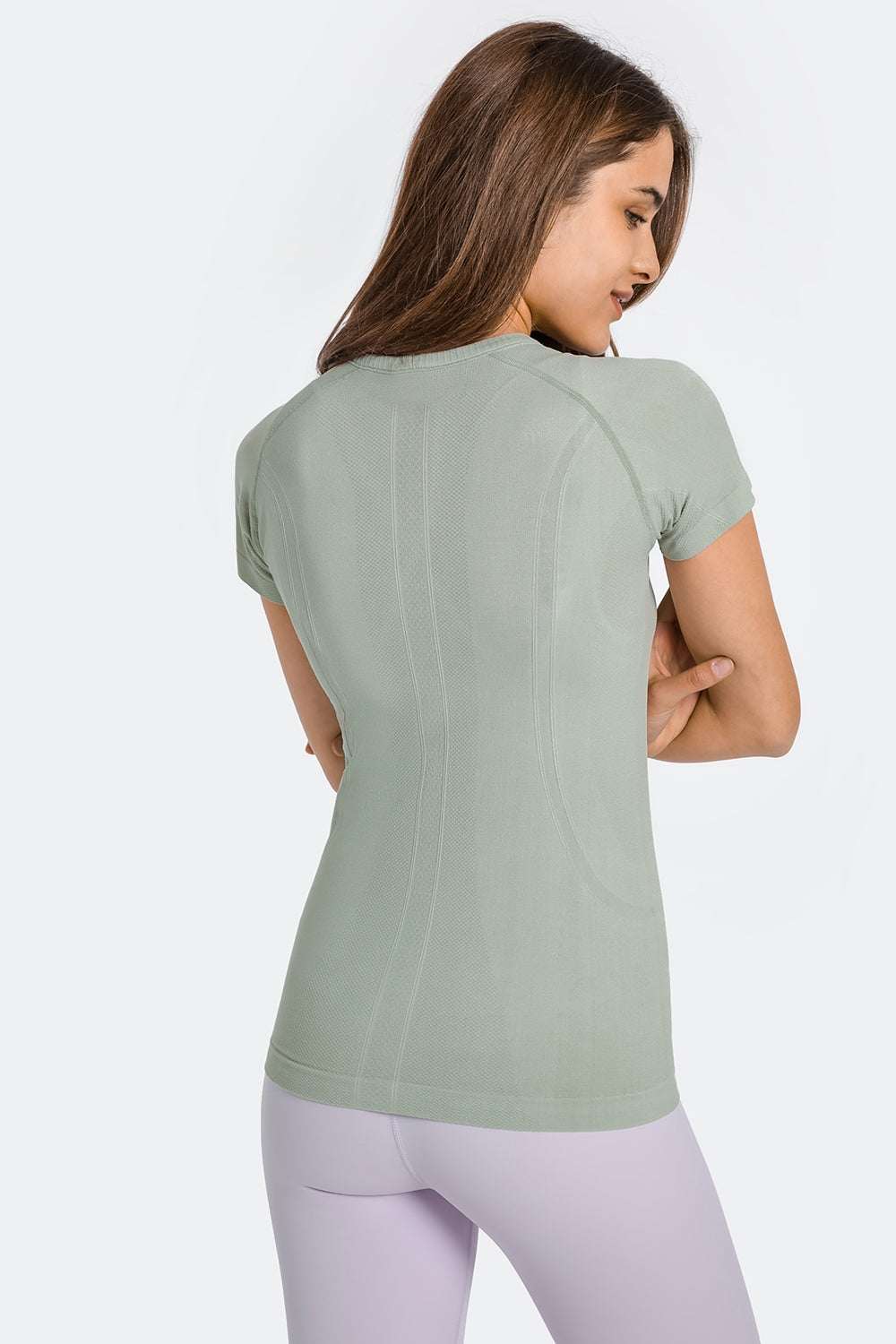 Millennia Round Neck Short Sleeve Active T-Shirt in green, back view, showing sleek fit and slight stretch.